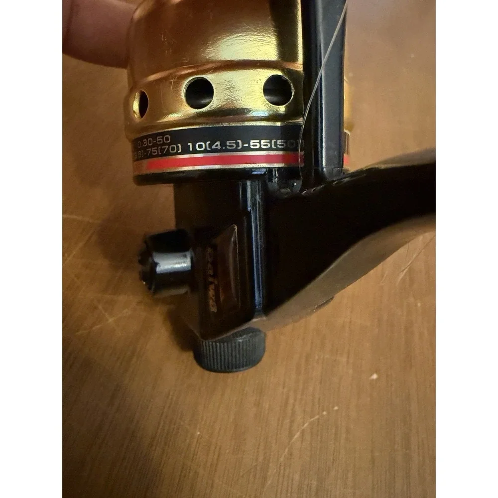 Vintage Daiwa US-80XA Spincast Fishing Reel - Gold & Black Micro Adjustable Drag